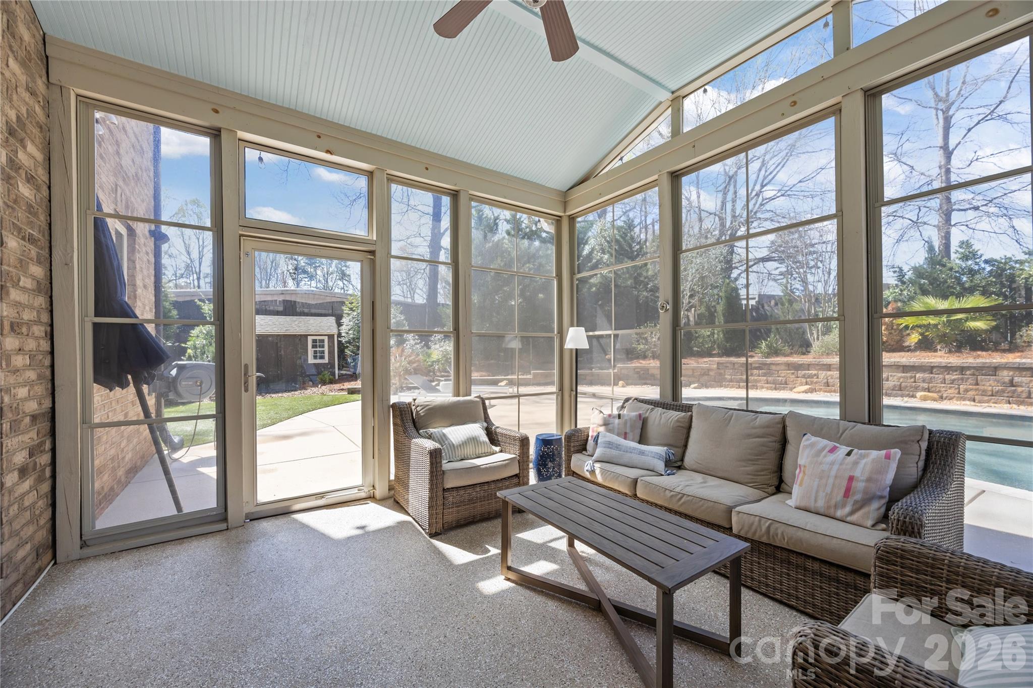 921 Rock Forest Way Fort Mill, SC 29707 - Photo 21 of 40 a living room with furniture and a floor to ceiling window