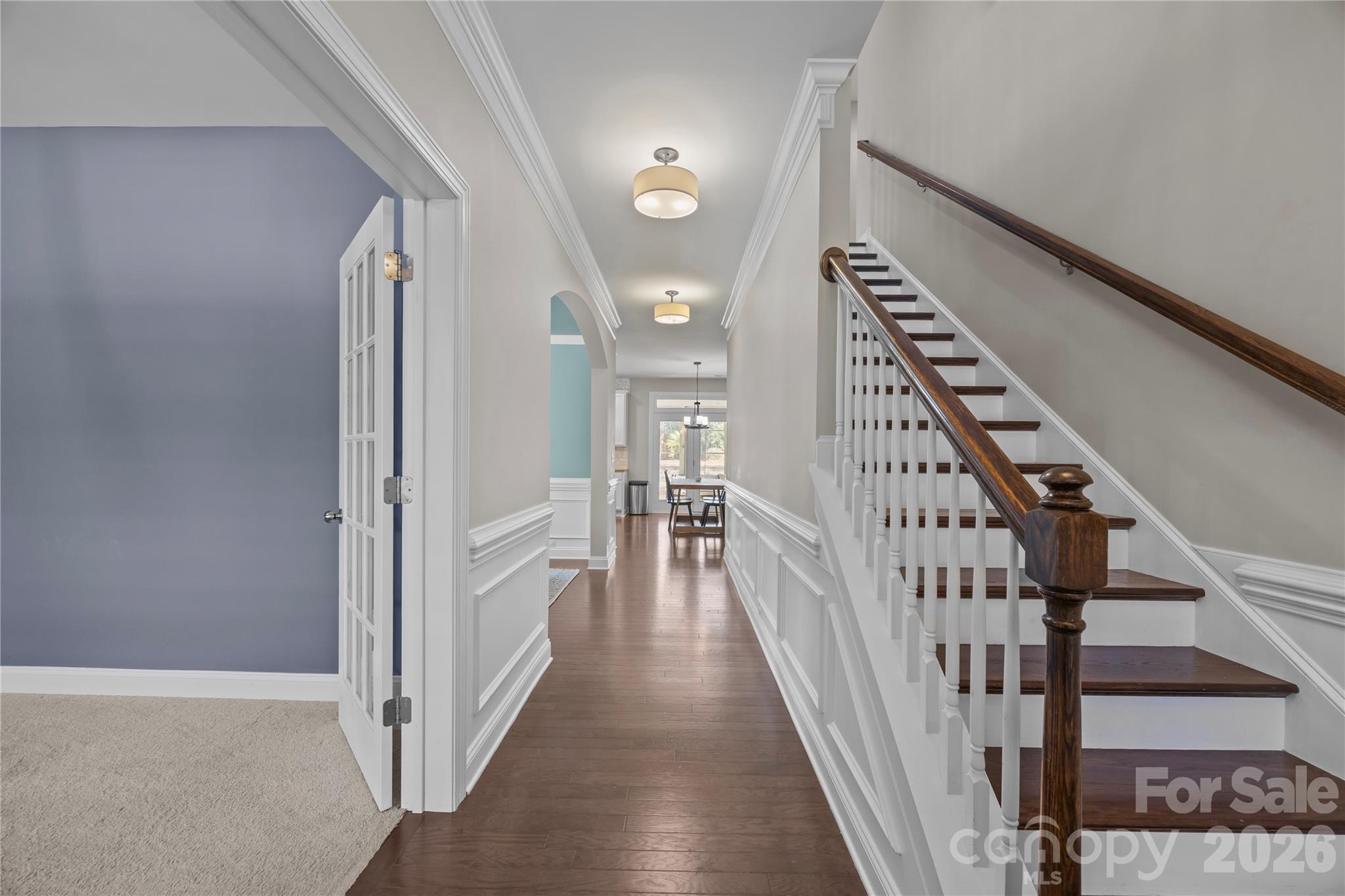 921 Rock Forest Way Fort Mill, SC 29707 - Photo 22 of 40 a view of a hallway with wooden floor and staircase