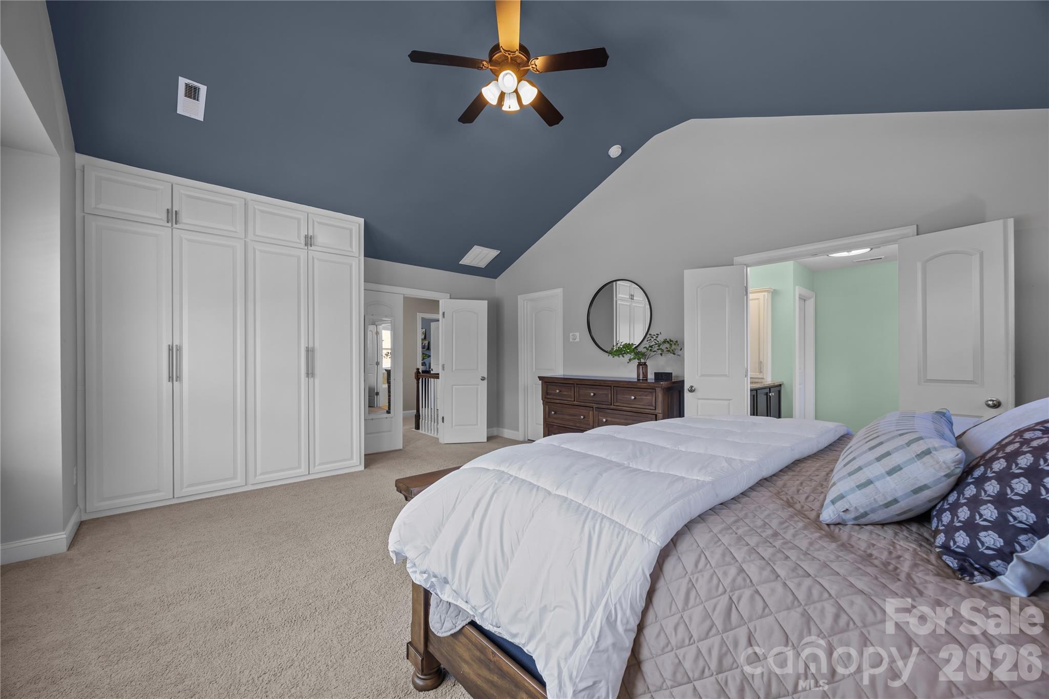 921 Rock Forest Way Fort Mill, SC 29707 - Photo 24 of 40 a bedroom with a large bed closet and a mirror