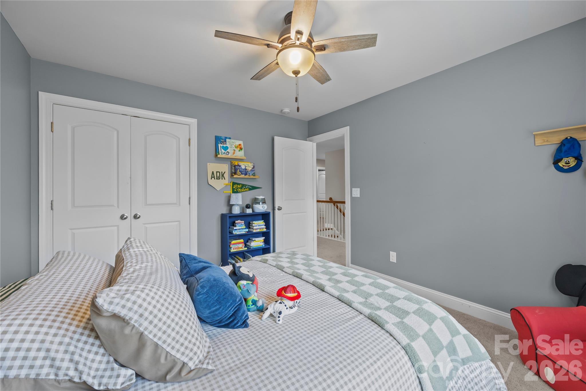 921 Rock Forest Way Fort Mill, SC 29707 - Photo 27 of 40 a bedroom with a bed and a chandelier