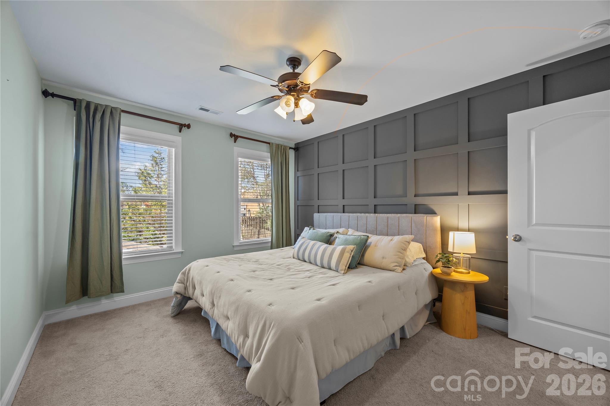 921 Rock Forest Way Fort Mill, SC 29707 - Photo 32 of 40 a bedroom with a bed and a chandelier