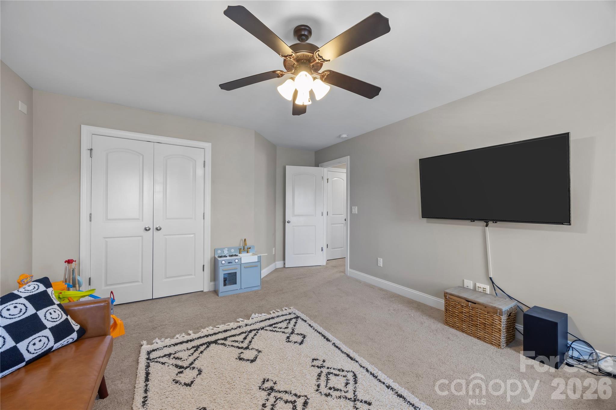 921 Rock Forest Way Fort Mill, SC 29707 - Photo 34 of 40 a bedroom with a bed and a flat screen tv