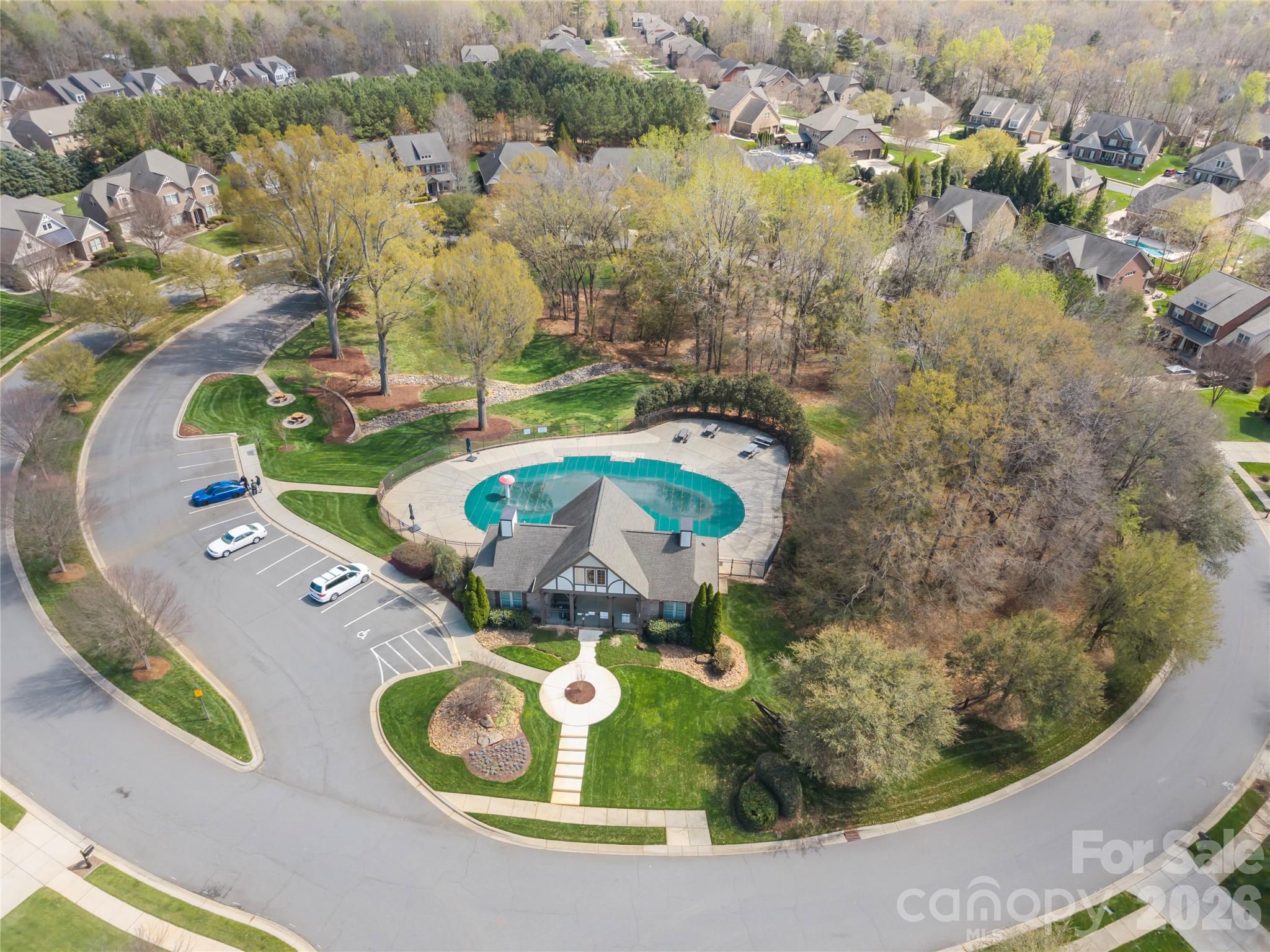 921 Rock Forest Way Fort Mill, SC 29707 - Photo 38 of 40 an aerial view of a swimming pool patio yard and lake view
