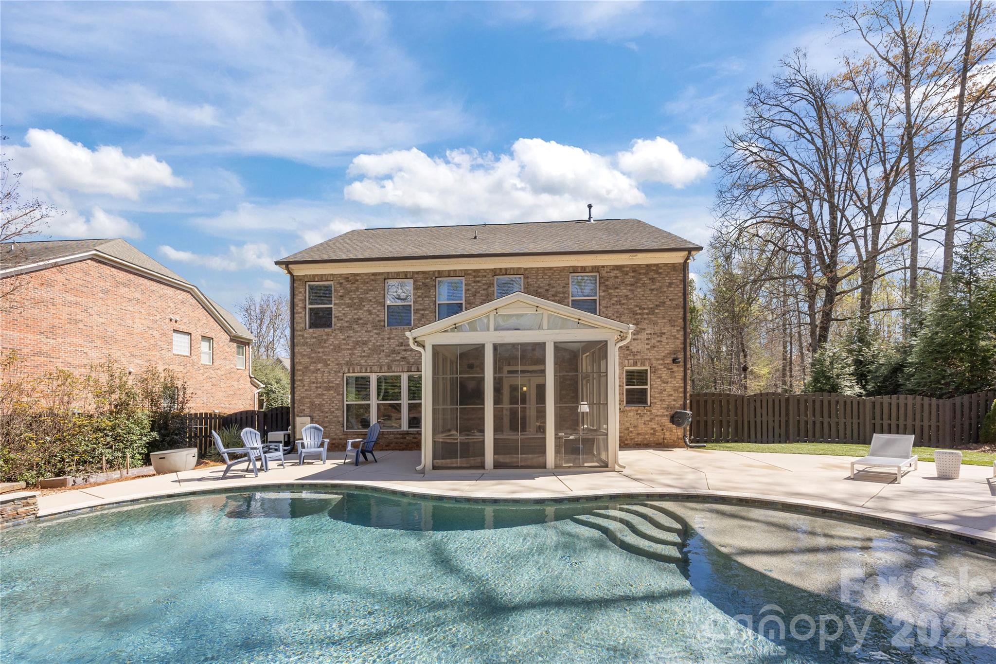 921 Rock Forest Way Fort Mill, SC 29707 - Photo 4 of 40 a view of a house with swimming pool and sitting area