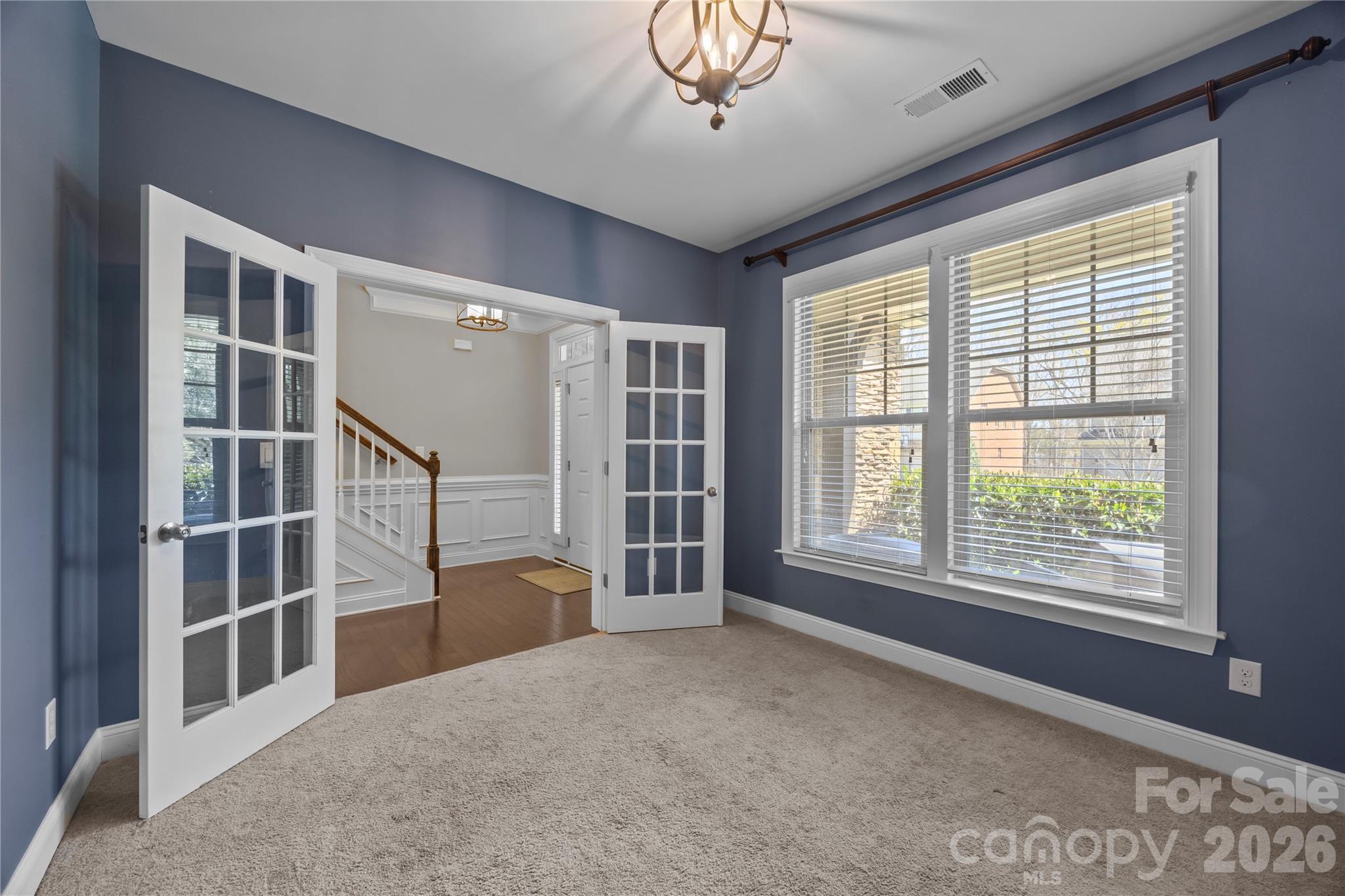921 Rock Forest Way Fort Mill, SC 29707 - Photo 7 of 40 a view of livingroom with furniture staircase and windows