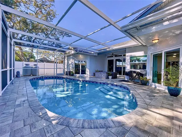 an aerial view of a golf course with a lake view