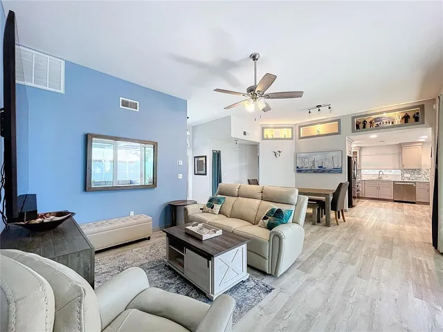 a kitchen with a sink stove and microwave