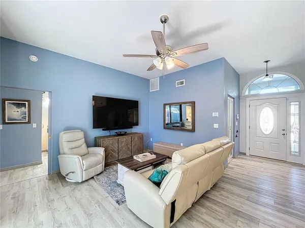 a kitchen with stainless steel appliances granite countertop a refrigerator and a stove