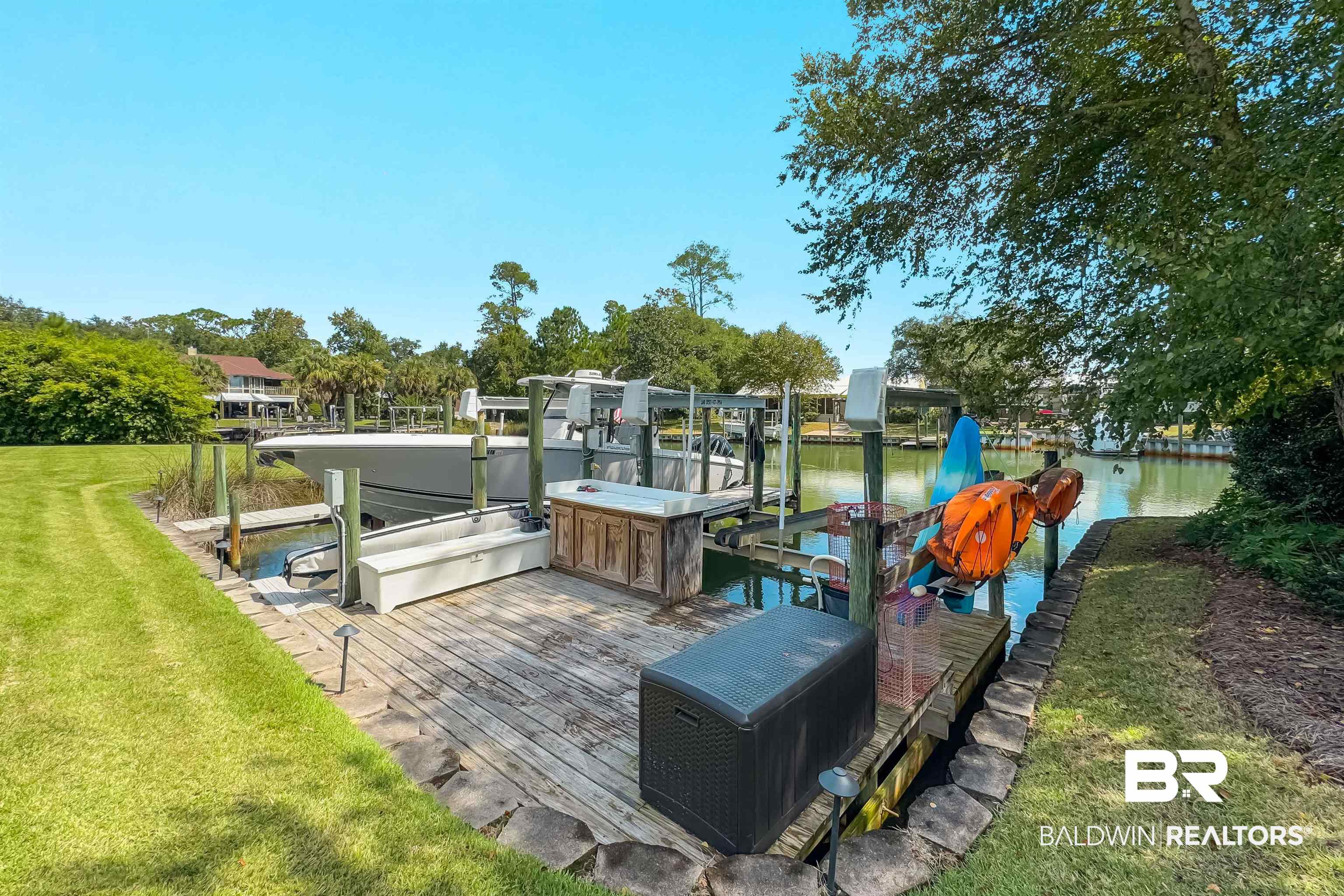 6630 East Quarry Drive Elberta, AL 36530 - Photo 49 of 63 Dock with a water view, boat lift, and a yard
