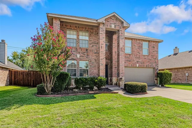 a front view of house with yard and outdoor seating