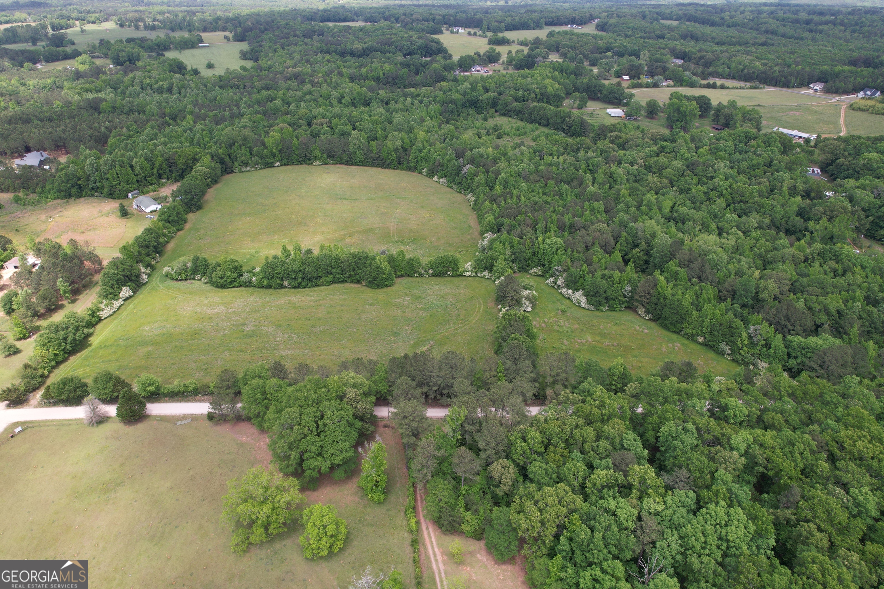0 Glover Road Zebulon, GA 30295 - Photo 1 of 1 an aerial view of a house with a yard and lake view
