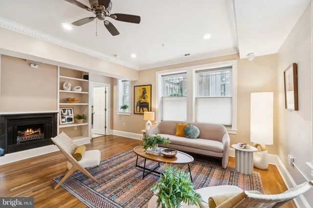 a living room with furniture and a fireplace