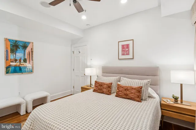 a bedroom with a bed and a lamp