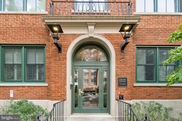 a view of a brick house with a large window