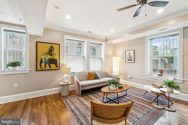 a living room with furniture and a window