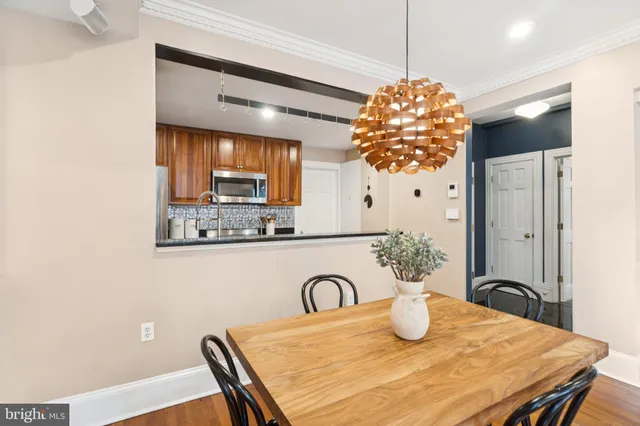 a kitchen with a table and chairs