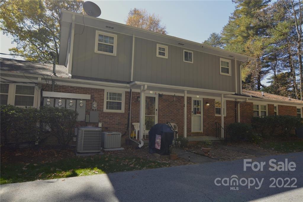 101 Boyd Drive, Unit 2B Flat Rock, NC 28731 - Photo 11 of 11 a view of a house with a yard