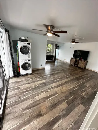 a view of a livingroom with furniture and gym equipment