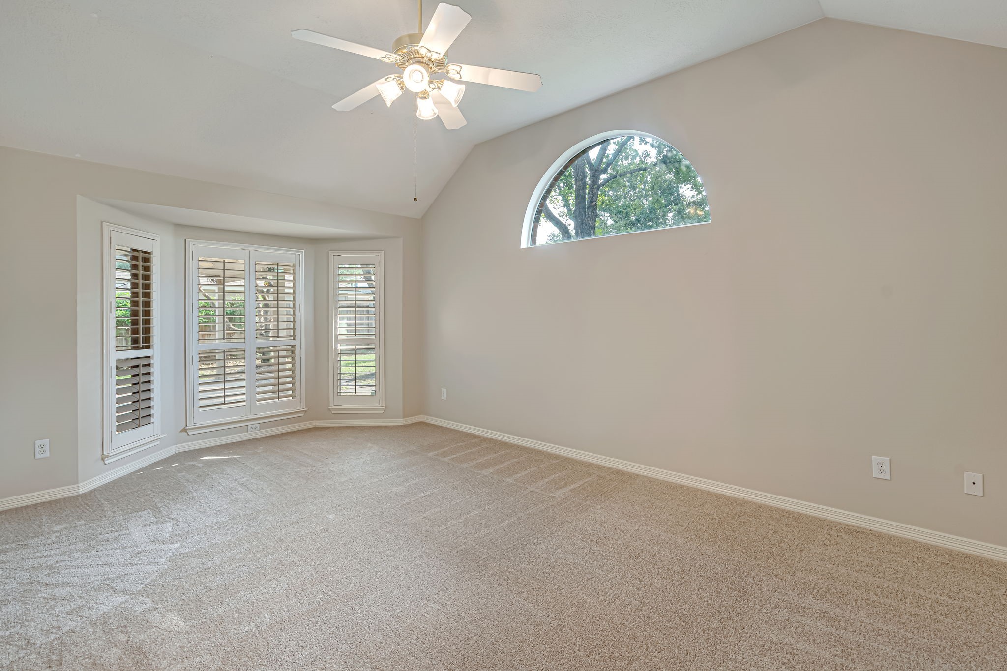 24919 Corbin Gate Drive Spring, TX 77389 - Photo 12 of 31 an empty room with windows and ceiling fan