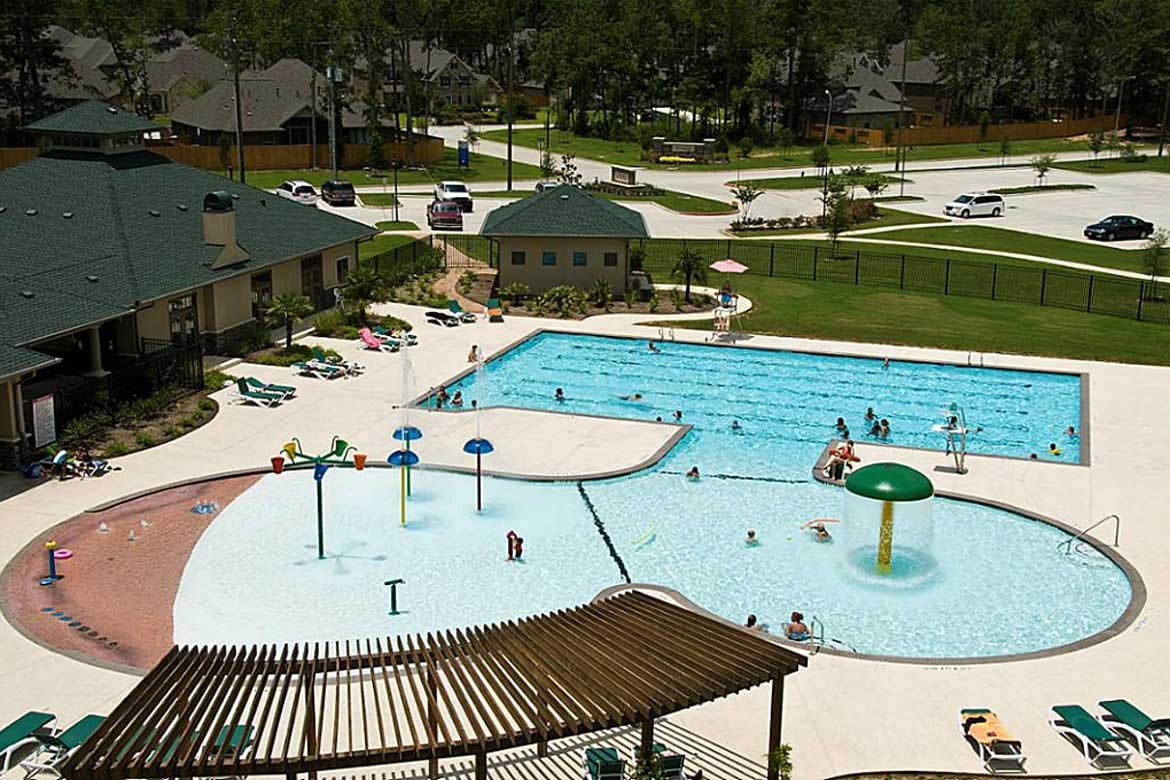 24919 Corbin Gate Drive Spring, TX 77389 - Photo 29 of 31 a view of a swimming pool with a patio and fire pit