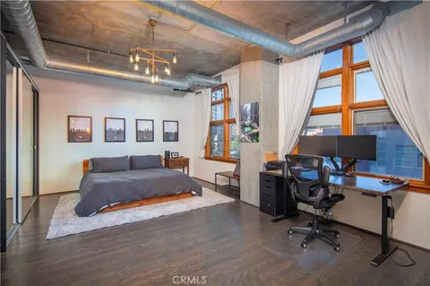 a bedroom with furniture and a window