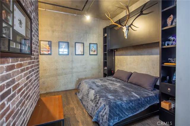 a bedroom with a bed and a dresser