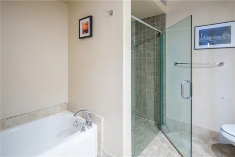 a view of a tall building next to a road