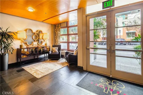 a room with gym equipment and a large window