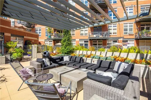 a kitchen with stainless steel appliances a sink and wooden cabinets