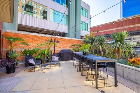 a view of a chairs and table in a patio
