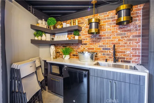 a view of a patio with iron fence