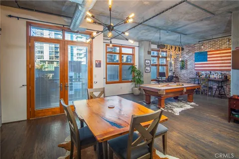 a kitchen with stainless steel appliances granite countertop a sink and a refrigerator