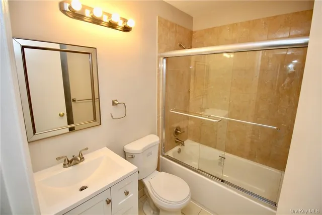 a bathroom with a sink a mirror and a shower