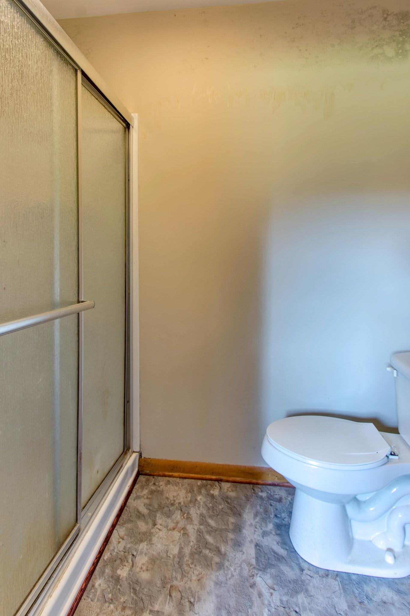 403 Park Creek Road Manchester, TN 37355 - Photo 14 of 24 a bathroom with a toilet and a shower