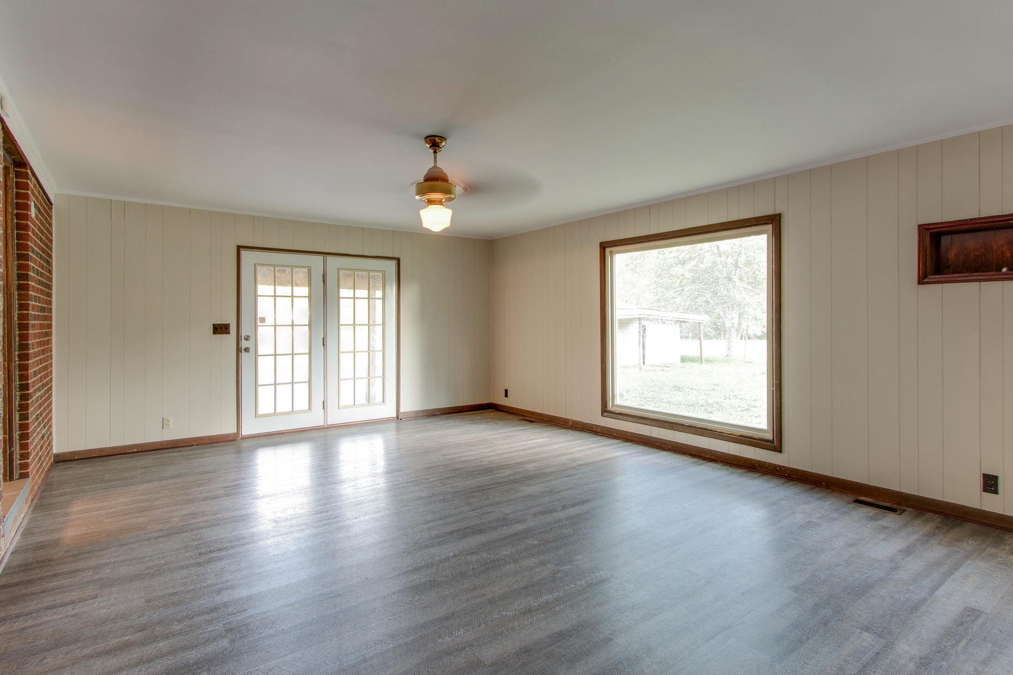403 Park Creek Road Manchester, TN 37355 - Photo 17 of 24 an empty room with wooden floor and windows