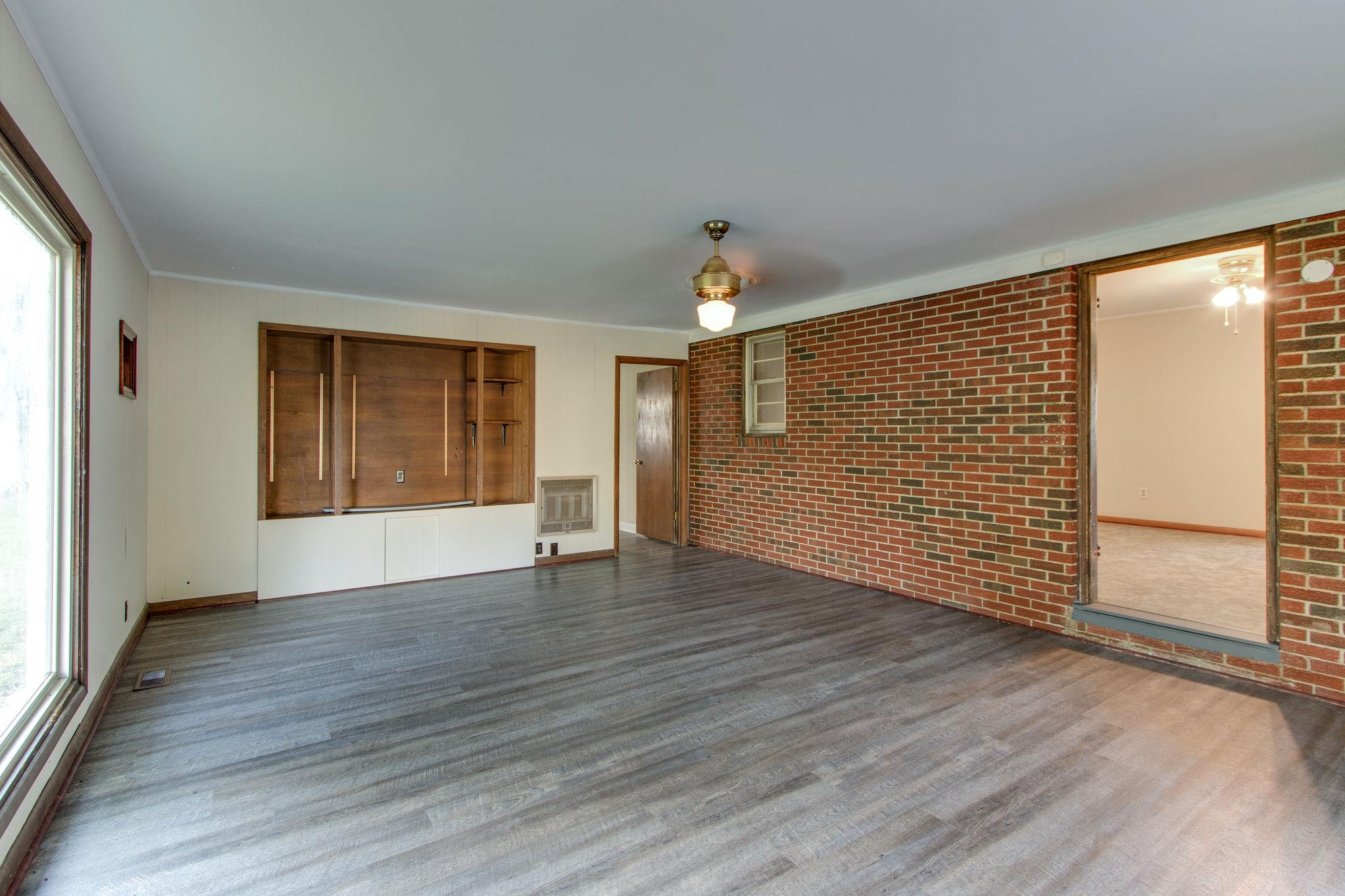 403 Park Creek Road Manchester, TN 37355 - Photo 18 of 24 a view of an empty room with wooden floor and a window