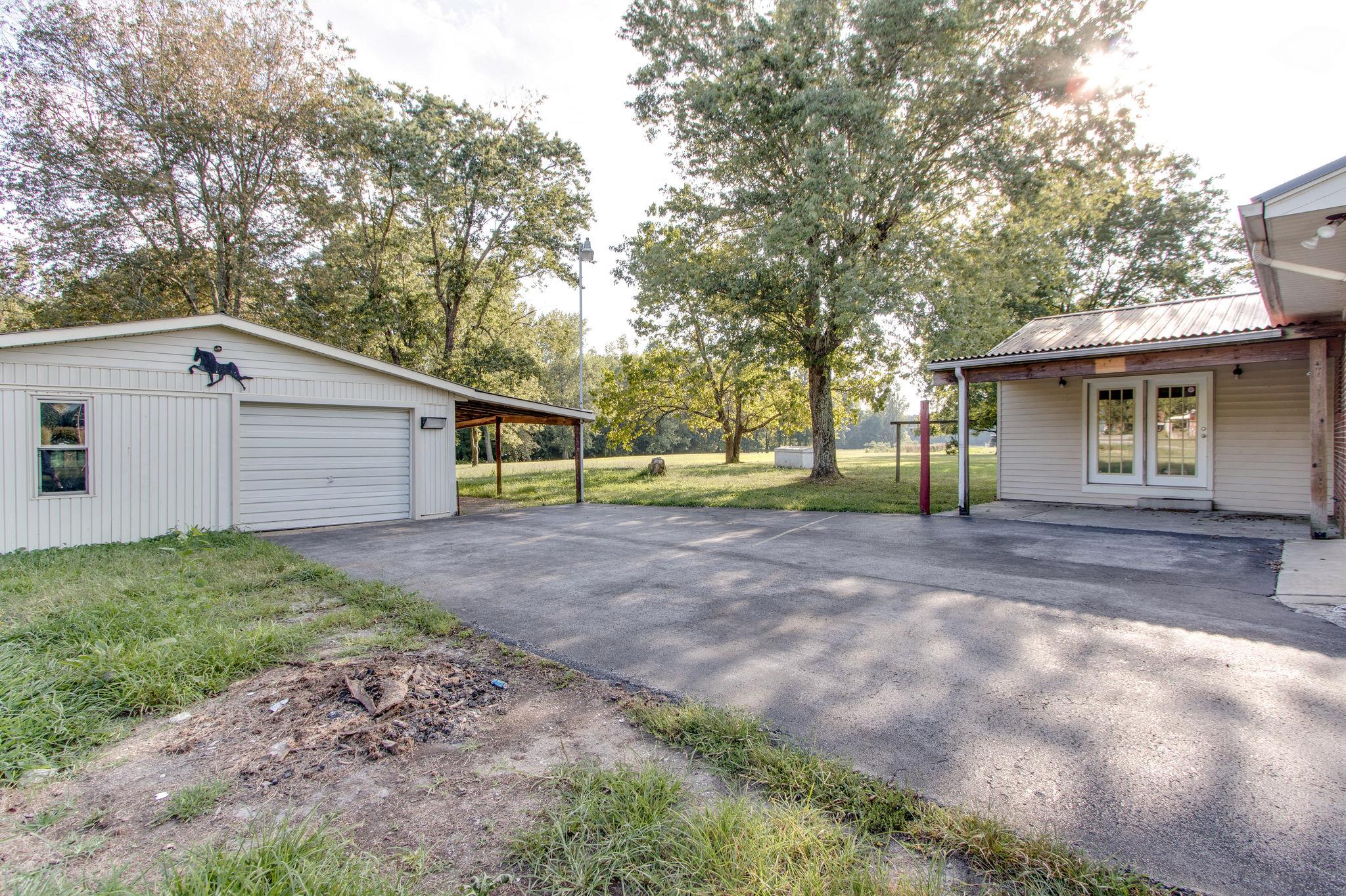 403 Park Creek Road Manchester, TN 37355 - Photo 22 of 24 a view of a backyard with large trees