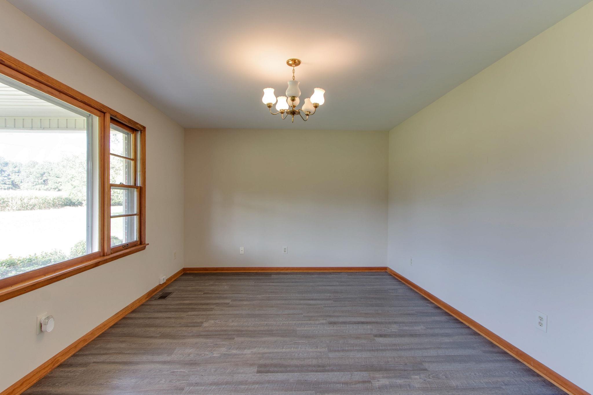 403 Park Creek Road Manchester, TN 37355 - Photo 3 of 24 wooden floor in an empty room with a window