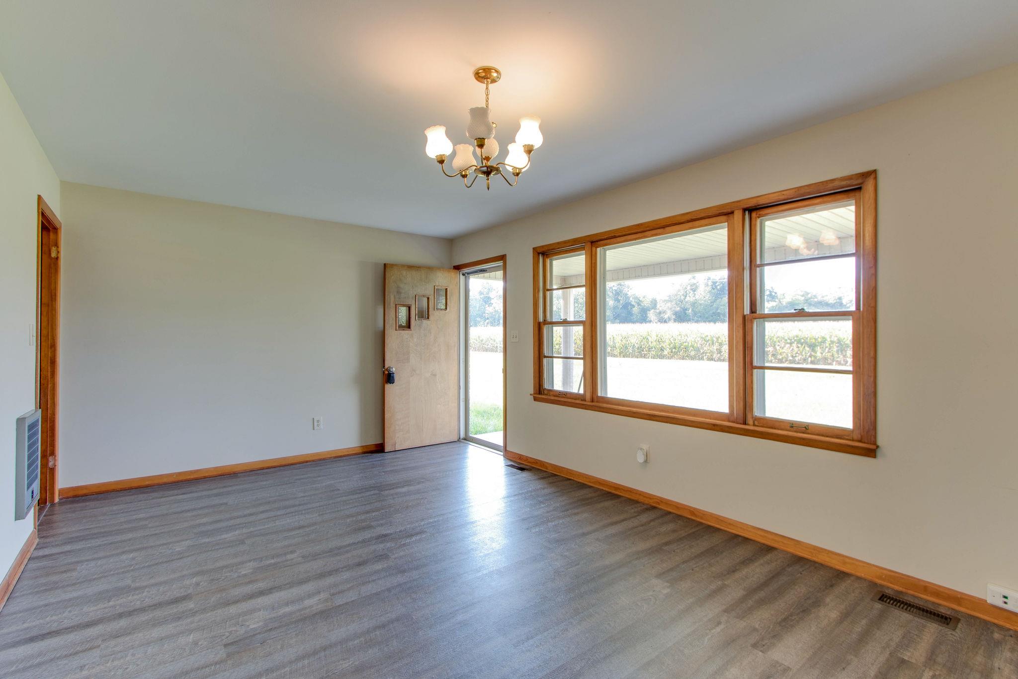 403 Park Creek Road Manchester, TN 37355 - Photo 4 of 24 a view of an empty room with wooden floor and a window
