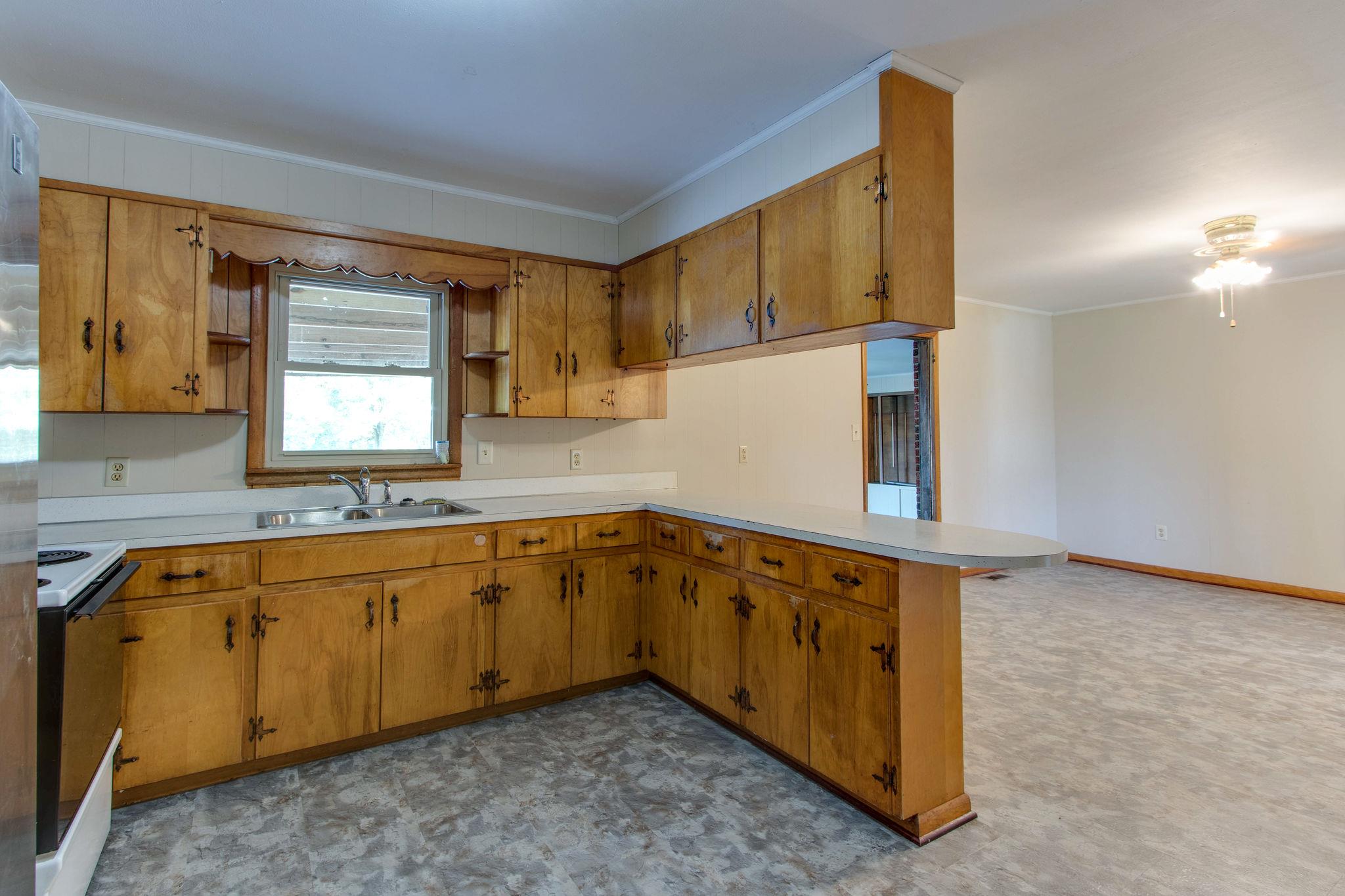 403 Park Creek Road Manchester, TN 37355 - Photo 6 of 24 a kitchen with stainless steel appliances granite countertop a sink and a cabinets