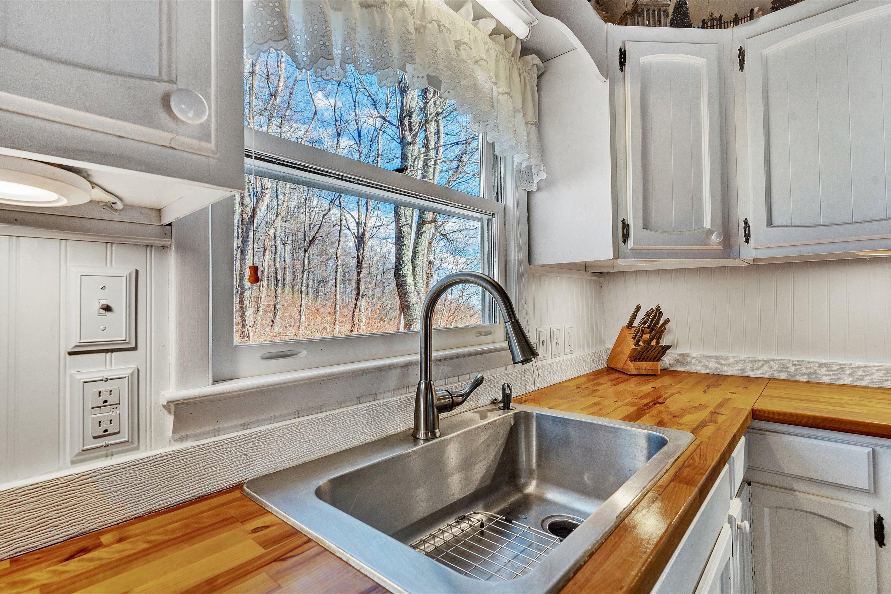 1575 Walnut Knob Road Floyd, VA 24091 - Photo 13 of 62 a kitchen with a window a sink and a counter top space