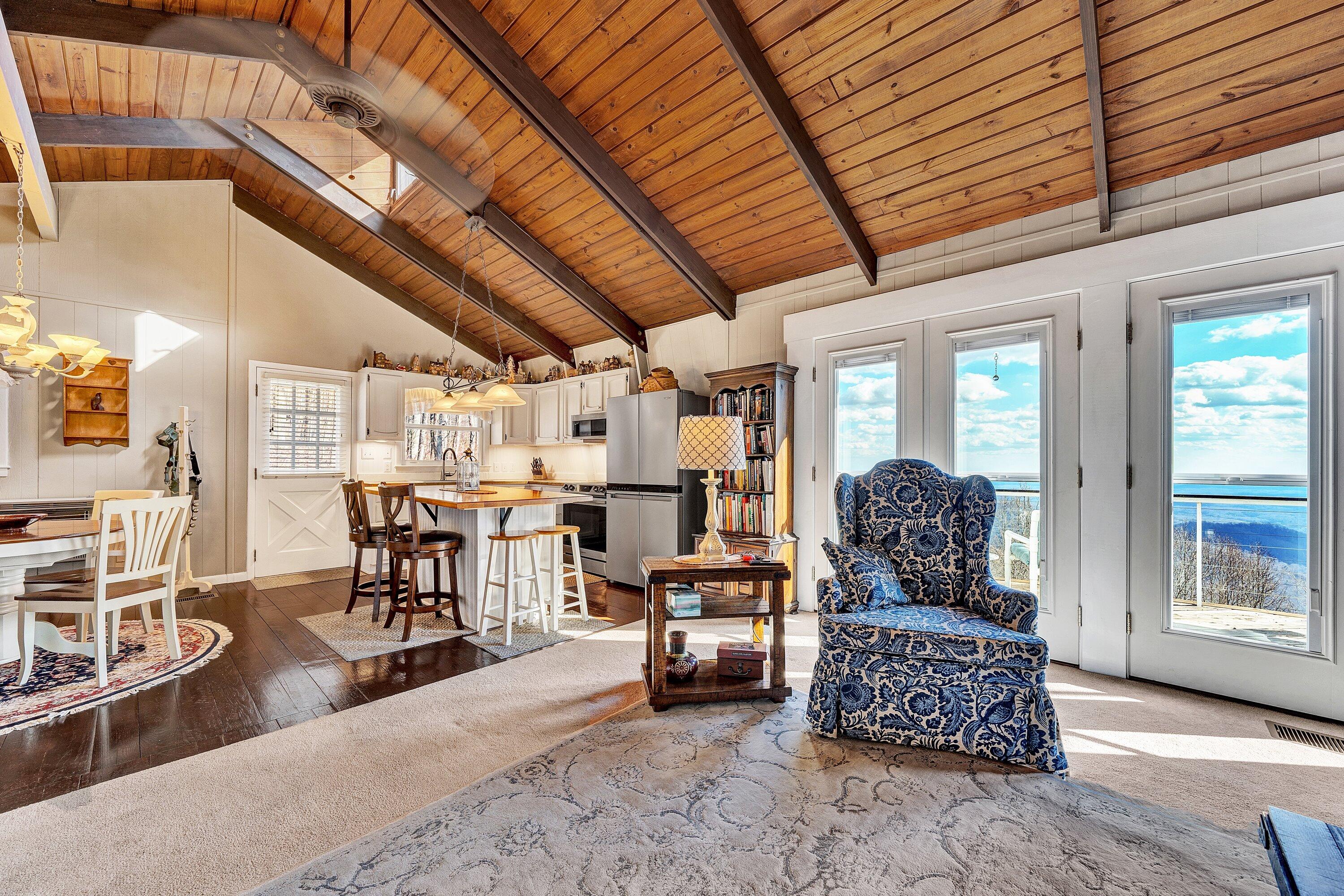 1575 Walnut Knob Road Floyd, VA 24091 - Photo 27 of 62 a living room with furniture a wooden floor and next to a window