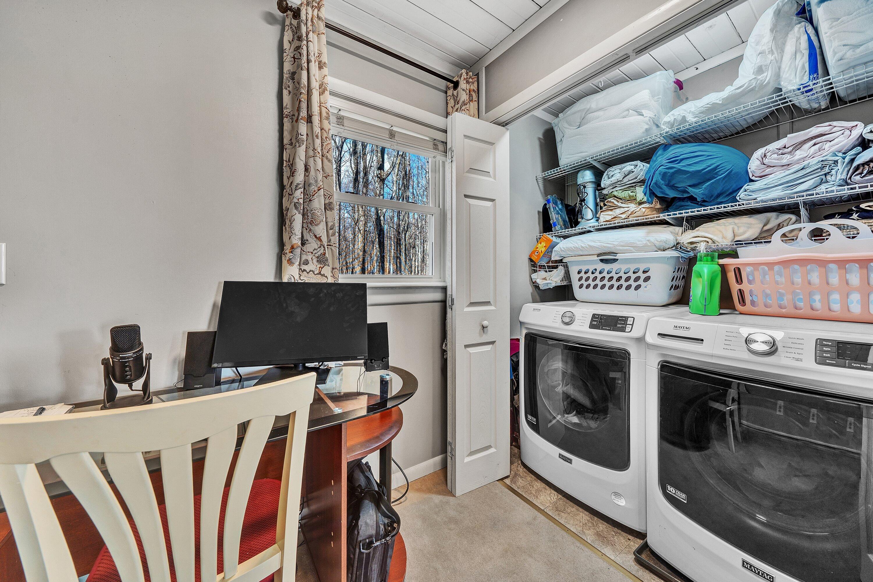 1575 Walnut Knob Road Floyd, VA 24091 - Photo 33 of 62 a view of a kitchen with fridge and wooden floor