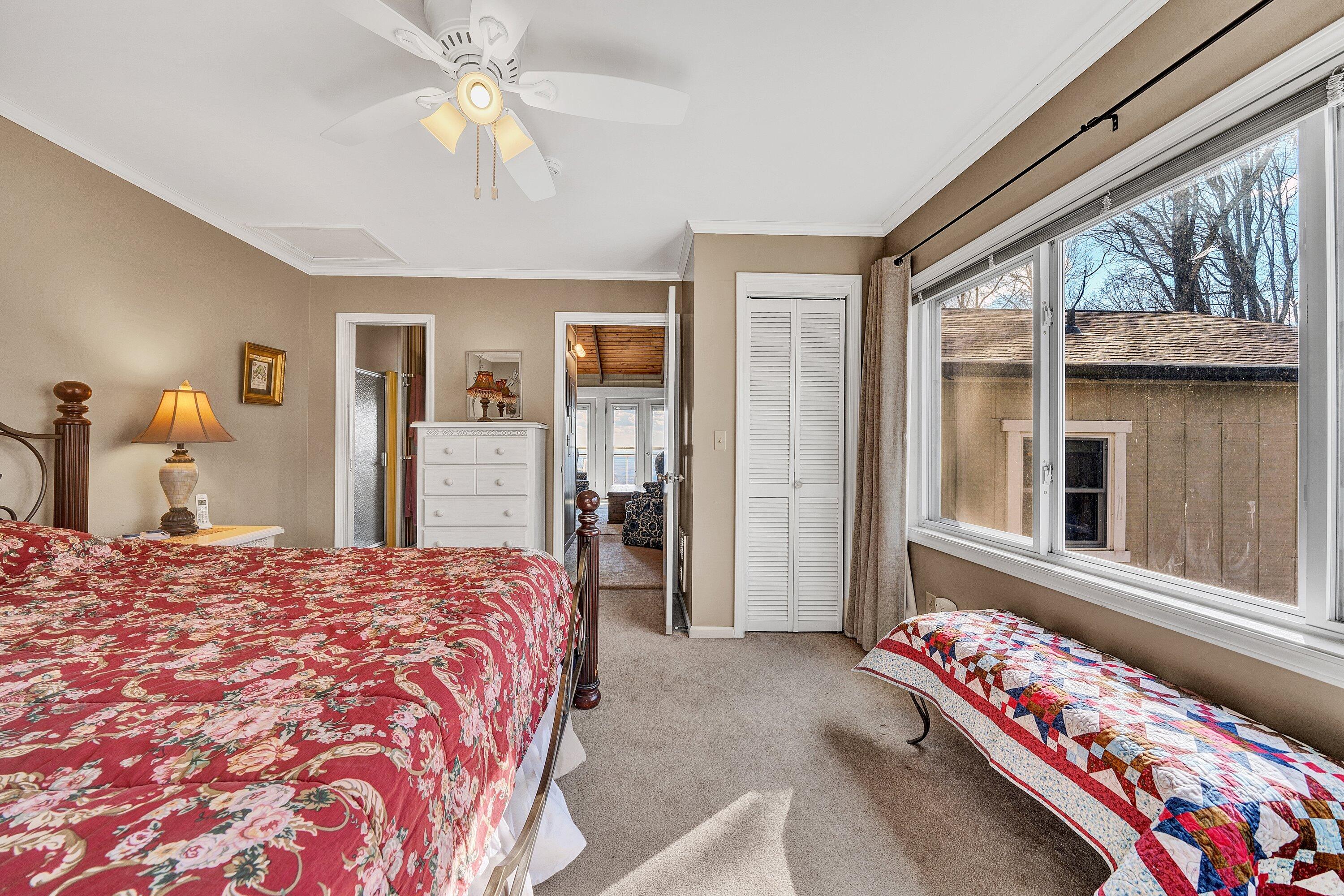 1575 Walnut Knob Road Floyd, VA 24091 - Photo 37 of 62 a bedroom with a bed mirror and a window