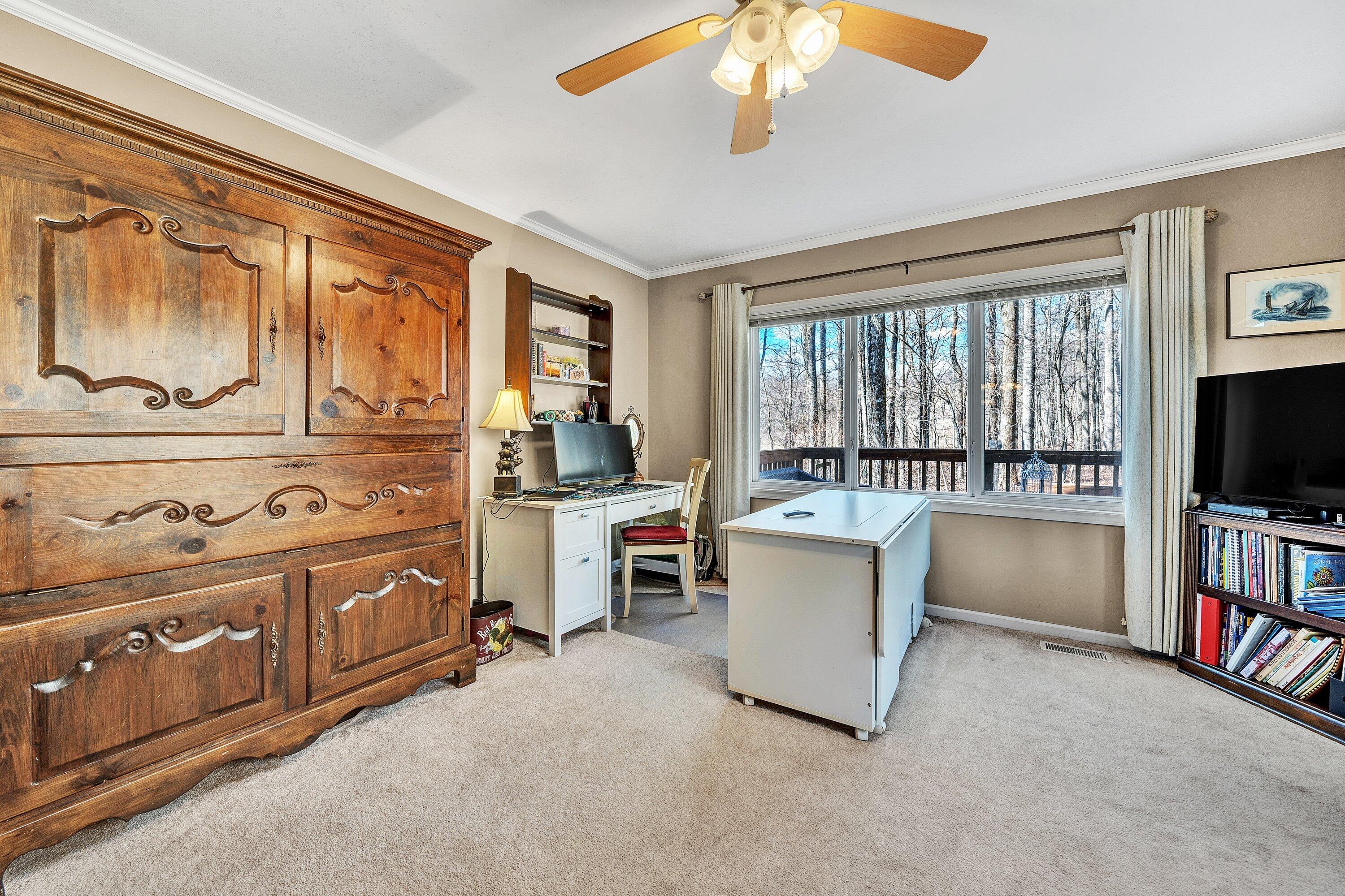 1575 Walnut Knob Road Floyd, VA 24091 - Photo 38 of 62 a living room with stainless steel appliances furniture and a flat screen tv