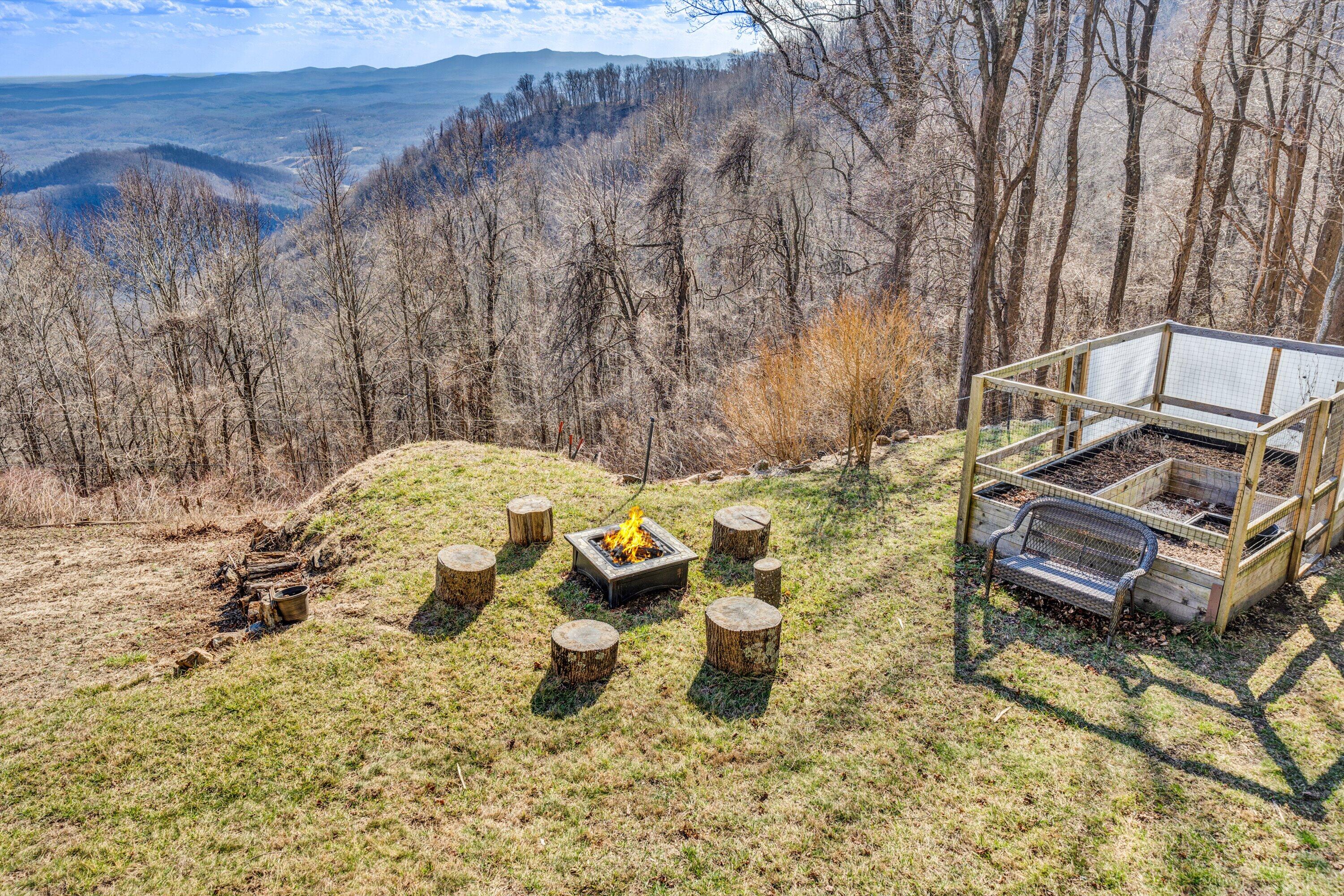 1575 Walnut Knob Road Floyd, VA 24091 - Photo 4 of 62 a view of a backyard with chairs and a table