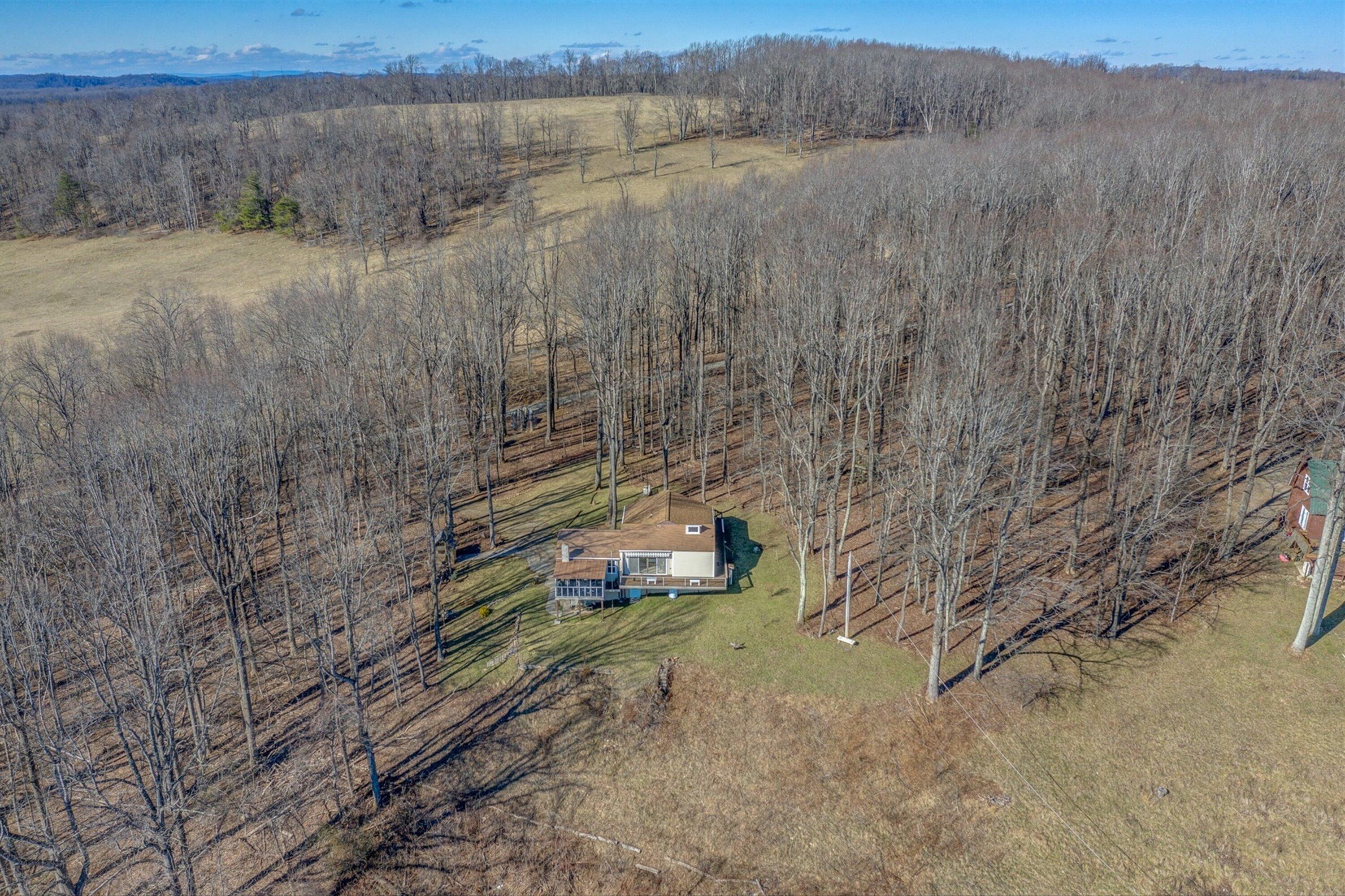 1575 Walnut Knob Road Floyd, VA 24091 - Photo 50 of 62 a view of a yard with wooden fence
