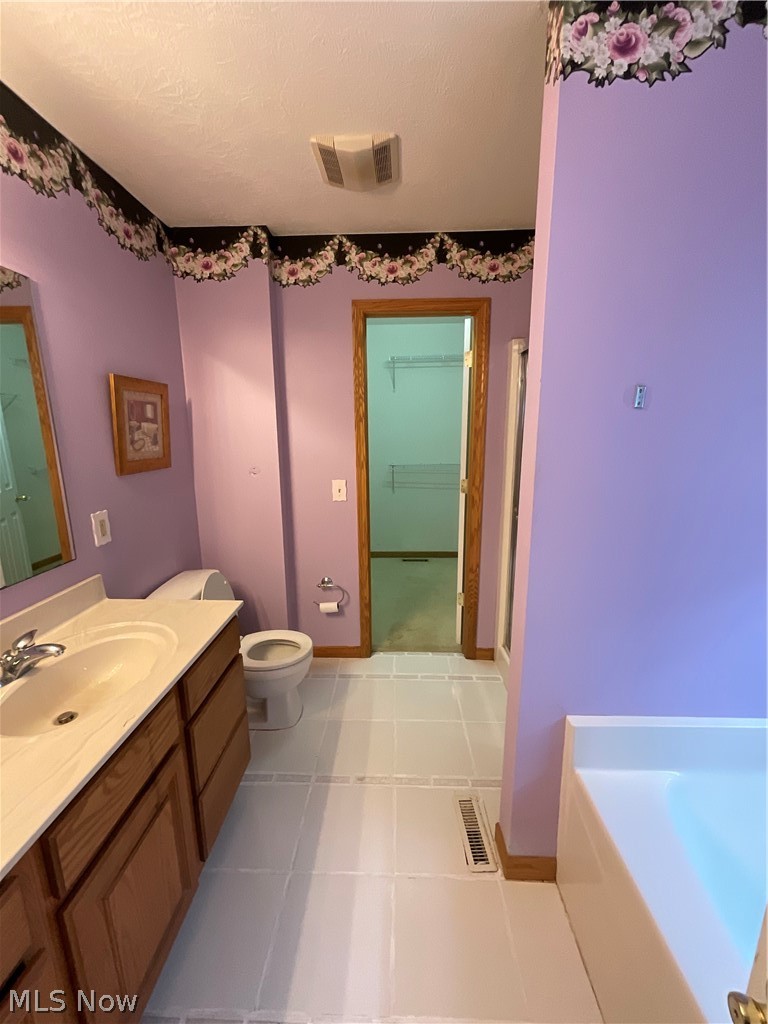 8603 Murray Road Cleveland, OH 44125 - Photo 21 of 26 Bathroom with toilet, tile floors, a bathtub, and vanity