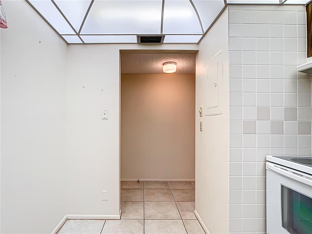 11485 Oakhurst Road, Unit 107 Largo, FL 33774 - Photo 15 of 60 a view of a livingroom with washer and dryer