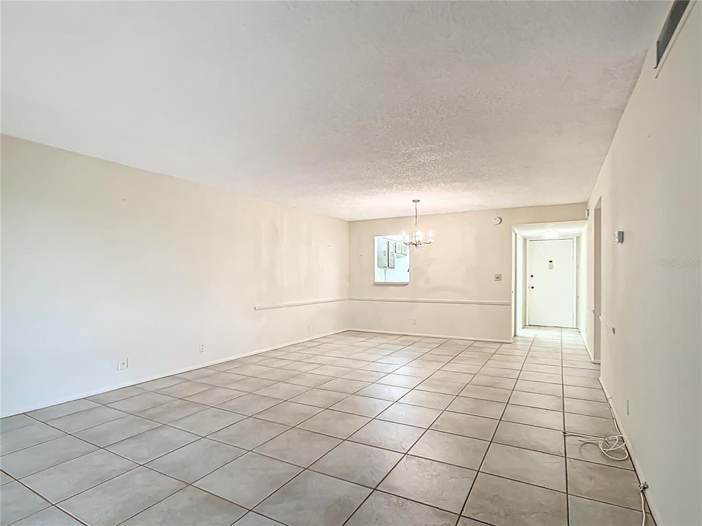 11485 Oakhurst Road, Unit 107 Largo, FL 33774 - Photo 23 of 60 a view of an empty room and window